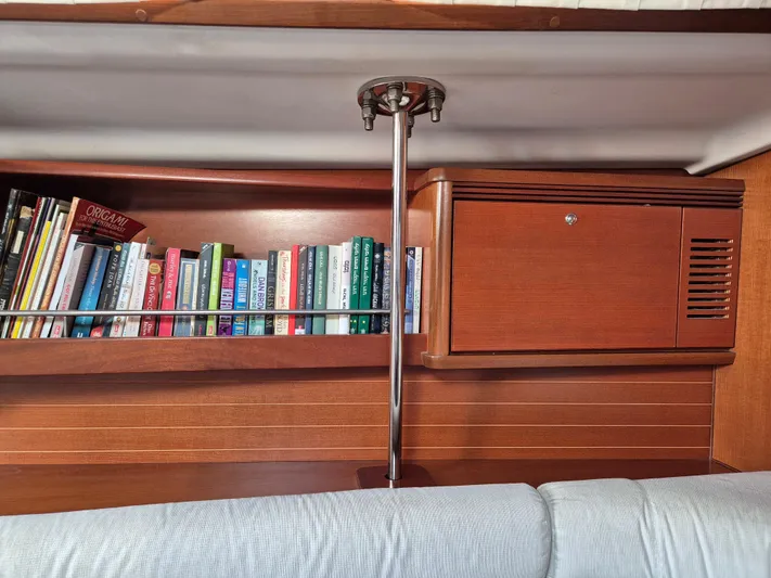 Princess Yacht Photos Pics Bookshelf and cabinet in a 2008 Grand Soleil 45 yacht interior.