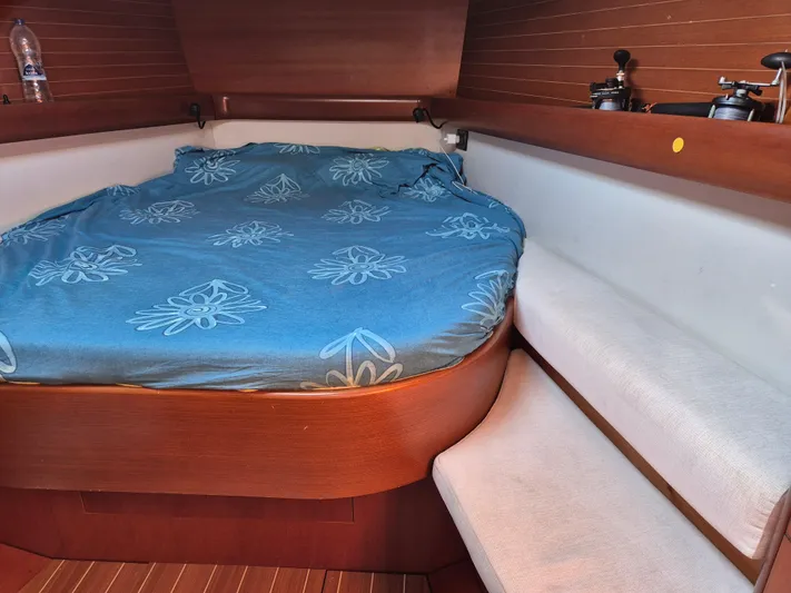 Princess Yacht Photos Pics Cozy cabin interior of 2008 Grand Soleil 45 sailboat with blue floral bedding.