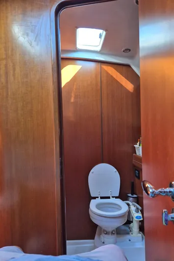 Princess Yacht Photos Pics 2008 Grand Soleil 45 yacht bathroom with wooden interior and skylight.