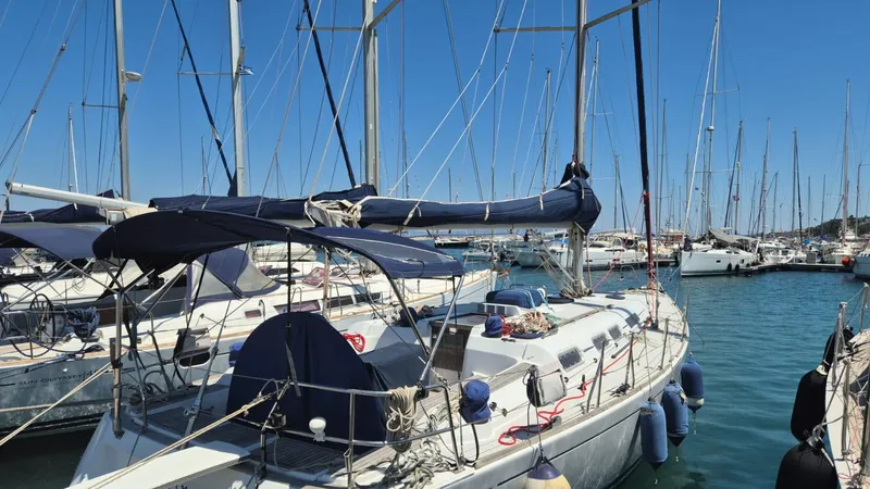 Princess Yacht Photos Pics Sailboats docked at a marina, featuring a 2008 Grand Soleil 45 under clear blue skies.
