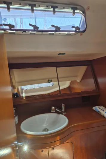 Princess Yacht Photos Pics Bathroom interior of 2008 Grand Soleil 45 yacht with sink and porthole.