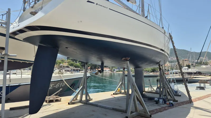 Princess Yacht Photos Pics Grand Soleil 45 sailboat from 2008 on dry dock, showcasing its hull and keel.