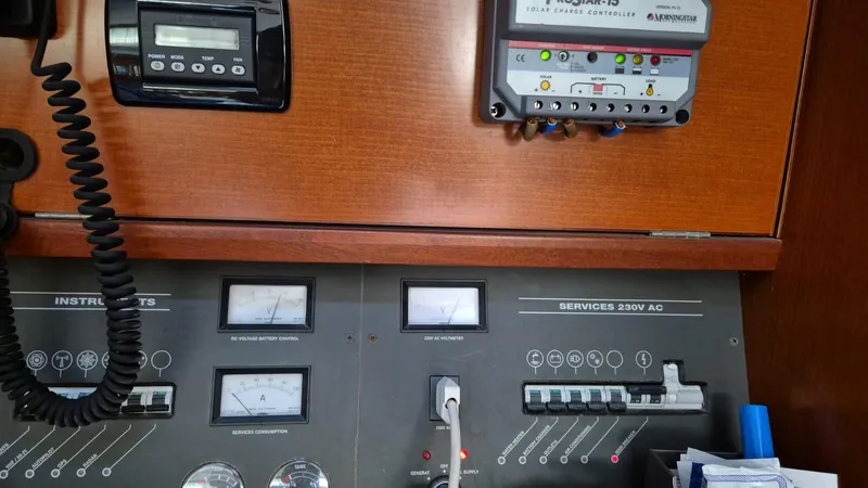 Princess Yacht Photos Pics Electrical control panel on a 2008 Grand Soleil 45 yacht, featuring instruments and solar charge controller.