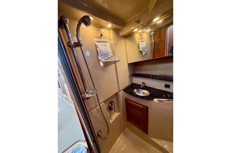 Yacht Photos Pics 2012 Ranger Tugs R-29 bathroom with shower, sink, and mirror in compact design.