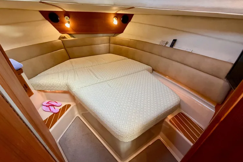  Yacht Photos Pics 2012 Ranger Tugs R-29 cabin interior with cozy bed and ambient lighting.