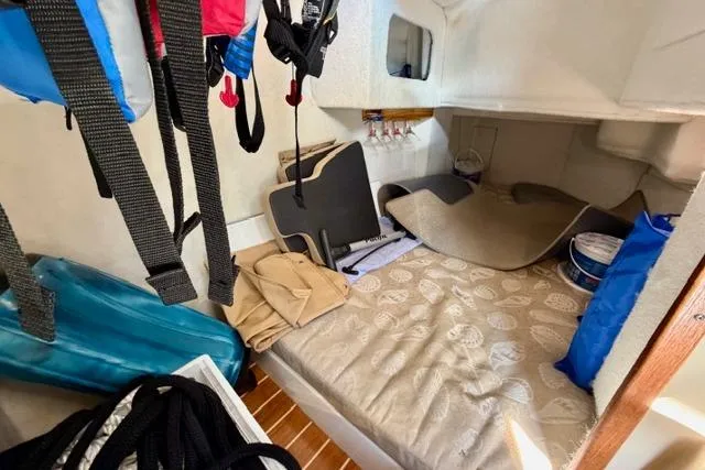  Yacht Photos Pics 2012 Ranger Tugs R-29 cabin interior with bed, storage, and nautical gear.