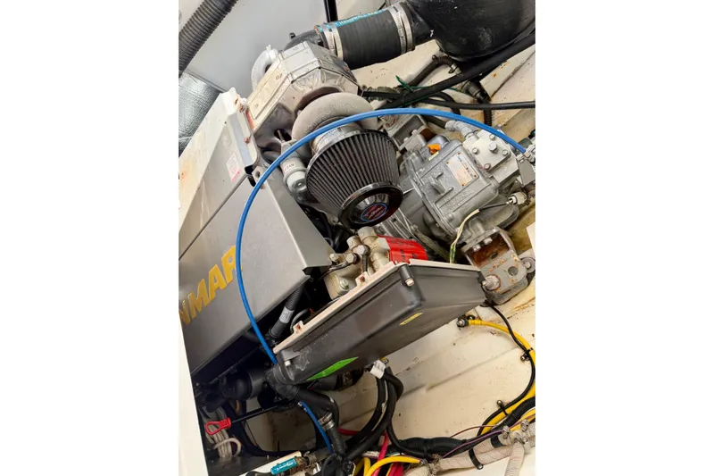  Yacht Photos Pics Engine compartment of a 2012 Ranger Tugs R-29 boat, showcasing mechanical components.