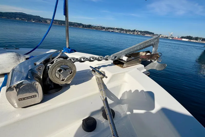  Yacht Photos Pics Anchor and winch on 2012 Ranger Tugs R-29 boat, docked in calm waters.