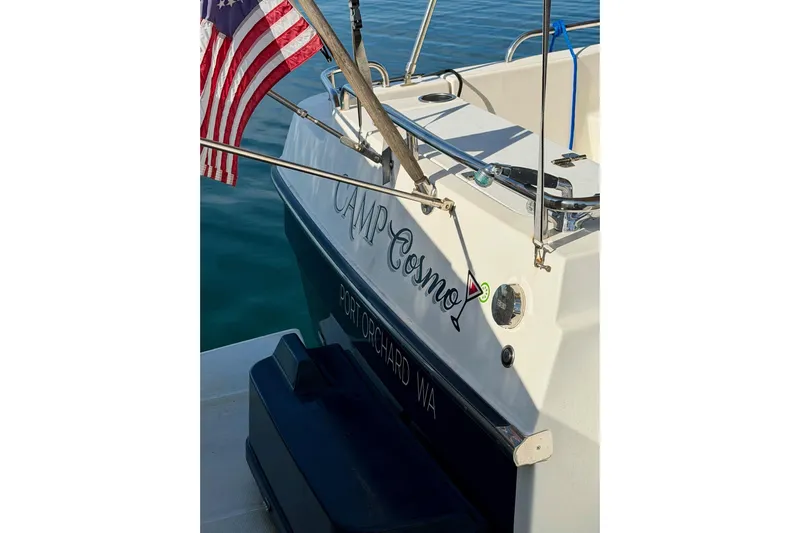  Yacht Photos Pics 2012 Ranger Tugs R-29 boat with American flag, named "Camp Cosmo," docked in Port Orchard, WA.