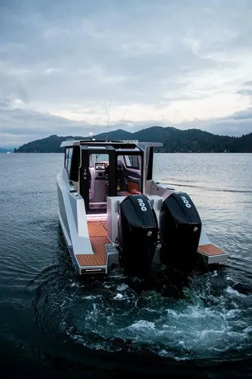  Yacht Photos Pics 2019 Jasper Marine Freedom 28 boat with dual engines on a serene lake.