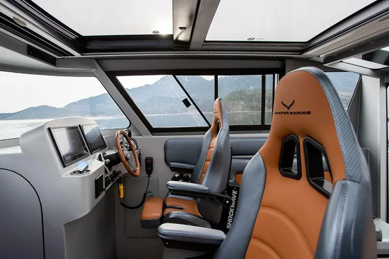  Yacht Photos Pics Interior of 2019 Jasper Marine Freedom 28 boat with modern cockpit and leather seats.