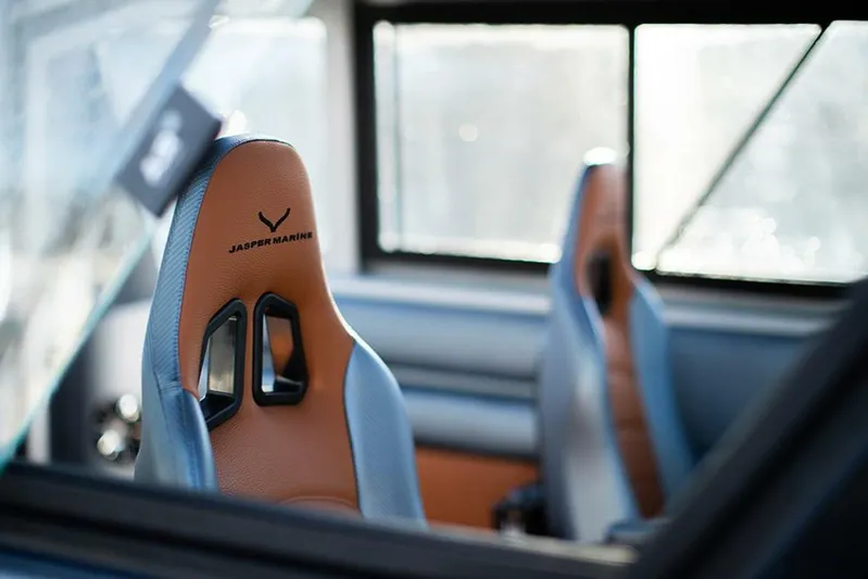  Yacht Photos Pics Interior of 2019 Jasper Marine Freedom 28, featuring stylish leather seats and modern design.