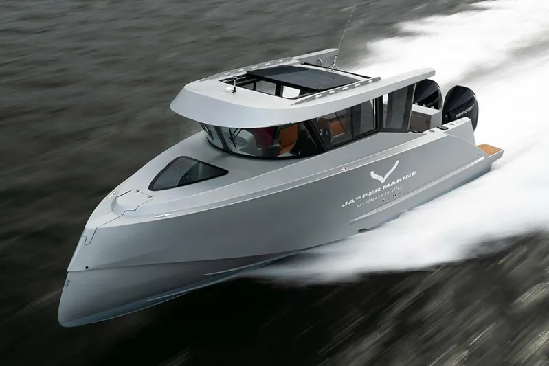  Yacht Photos Pics 2019 Jasper Marine Freedom 28 speeding on water, showcasing sleek design and powerful performance.