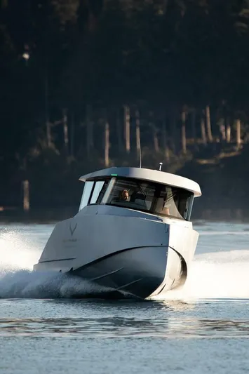  Yacht Photos Pics 2019 Jasper Marine Freedom 28 boat cruising on a serene waterway.