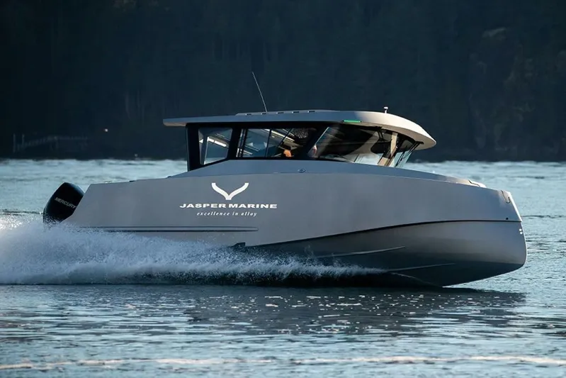  Yacht Photos Pics 2019 Jasper Marine Freedom 28 boat cruising on water at high speed.