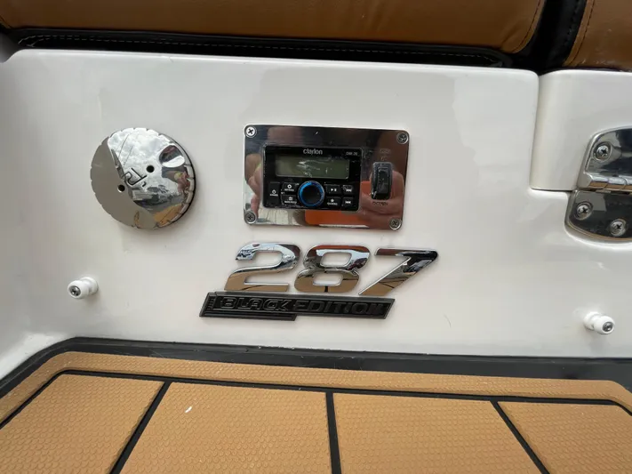  Yacht Photos Pics 2023 Chaparral 287 SSX boat dashboard with stereo system and model emblem.