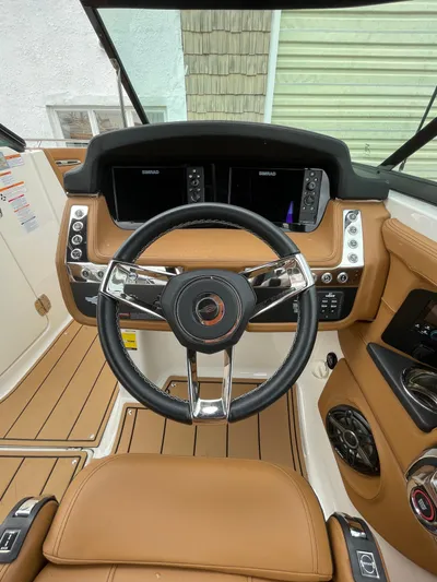  Yacht Photos Pics 2023 Chaparral 287 SSX boat dashboard with modern controls and sleek design.