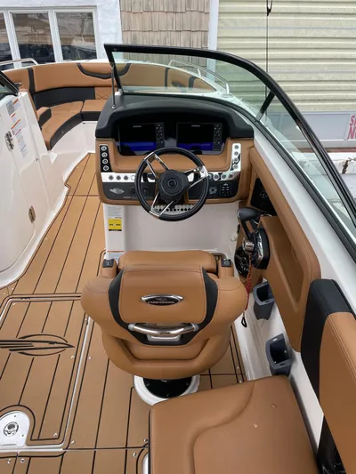  Yacht Photos Pics 2023 Chaparral 287 SSX boat interior with tan seating and modern dashboard.