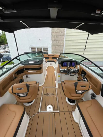  Yacht Photos Pics 2023 Chaparral 287 SSX boat interior with luxurious seating and modern dashboard.