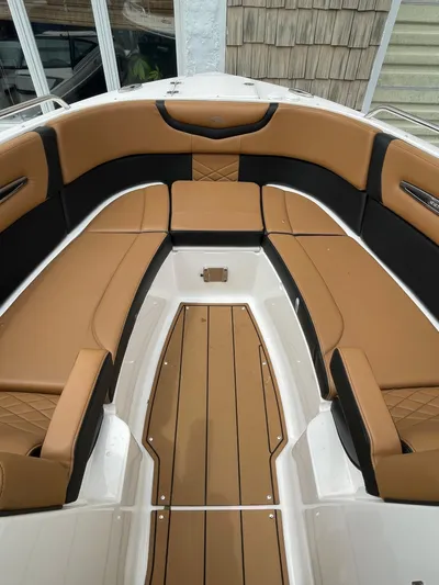  Yacht Photos Pics 2023 Chaparral 287 SSX boat interior with tan and black seating.