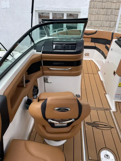  Yacht Photos Pics 2023 Chaparral 287 SSX boat interior with tan leather seating and sleek dashboard design.