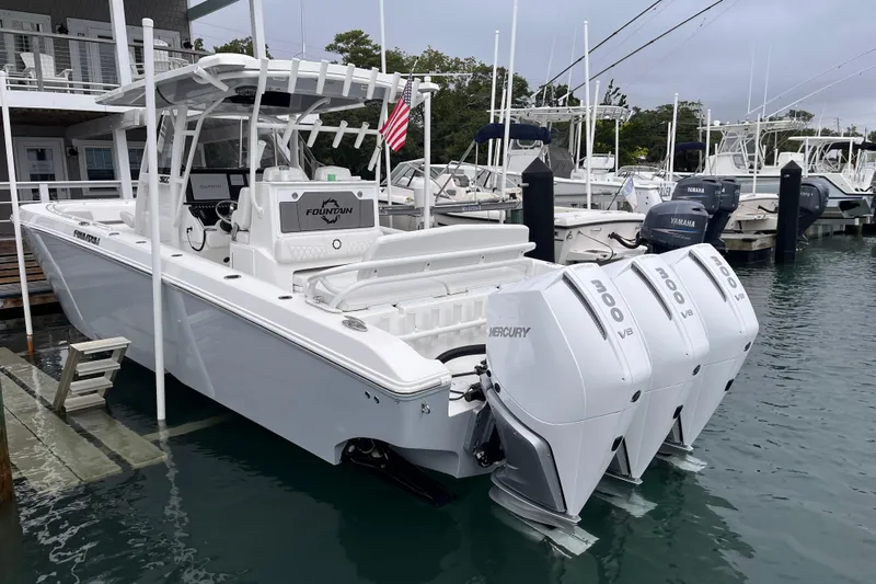  Yacht Photos Pics 2025 Fountain 34 CC boat docked with triple Mercury V8 engines.
