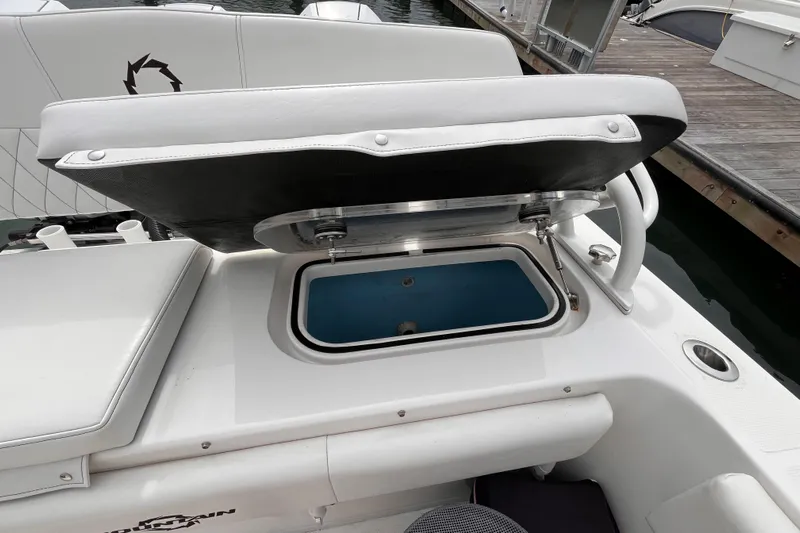  Yacht Photos Pics Open storage compartment on 2025 Fountain 34 CC boat, docked at marina.