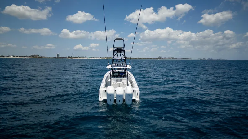 Pharma-sea Yacht Photos Pics 2023 Contender 44 CB boat on open sea under blue sky.