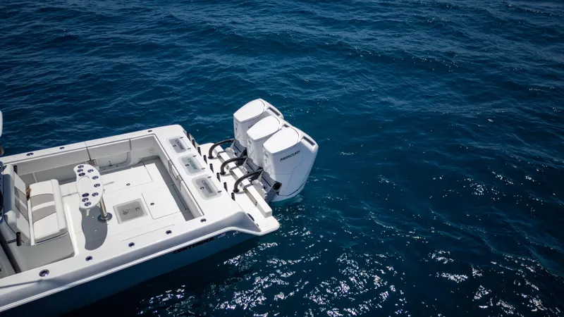 Pharma-sea Yacht Photos Pics 2023 Contender 44 CB boat with dual outboard motors on open sea.