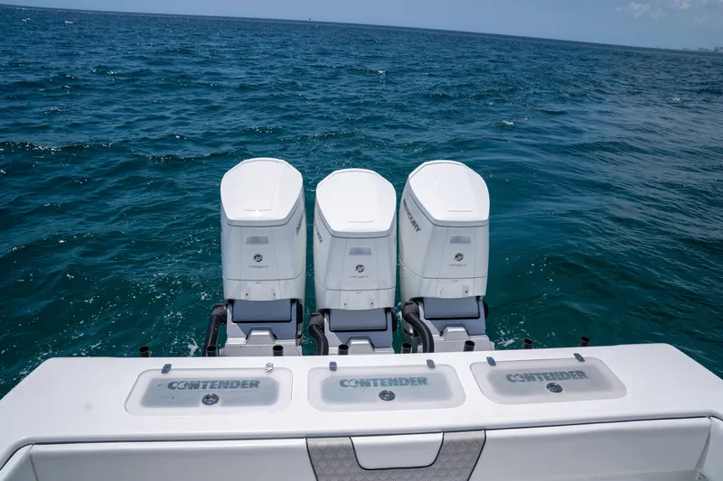 Pharma-sea Yacht Photos Pics 2023 Contender 44 CB boat with triple outboard engines on open sea.
