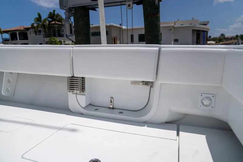 Pharma-sea Yacht Photos Pics 2023 Contender 44 CB boat interior with white seating and storage compartments.