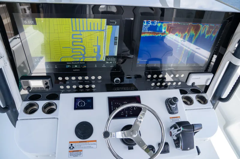 Pharma-sea Yacht Photos Pics Control panel of 2023 Contender 44 CB boat with navigation and sonar displays.