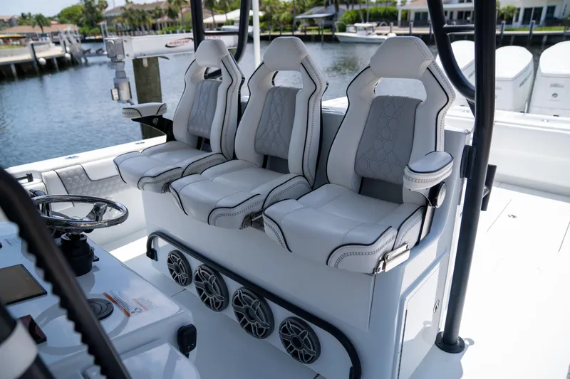 Pharma-sea Yacht Photos Pics Luxury seating on 2023 Contender 44 CB boat, featuring three cushioned seats and modern design.