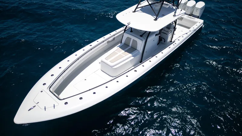 Pharma-sea Yacht Photos Pics 2023 Contender 44 CB boat on open water, showcasing sleek design and powerful engines.