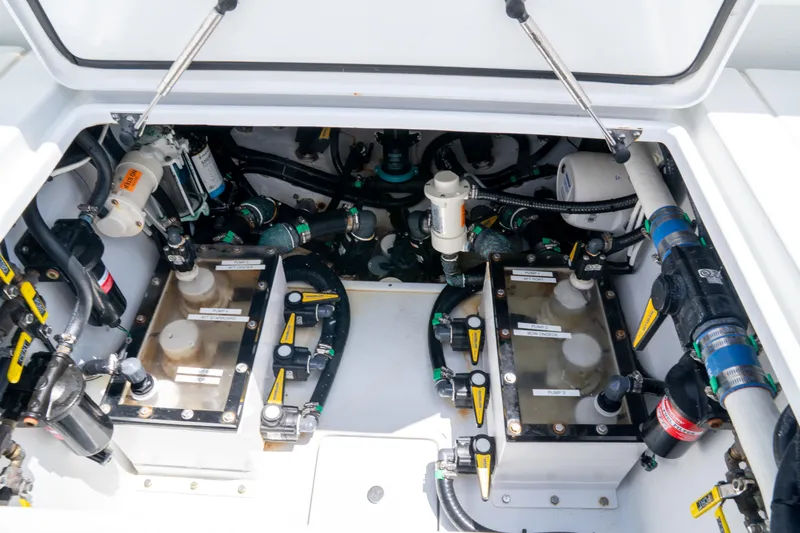Pharma-sea Yacht Photos Pics Engine compartment of 2023 Contender 44 CB boat, showcasing mechanical components and systems.