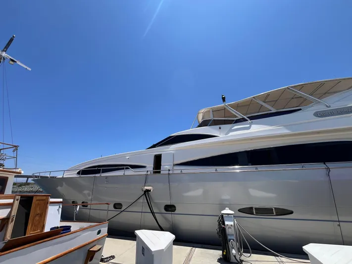 Endless Romance Yacht Photos Pics Astondoa 95GLX yacht from 2001 docked under clear blue sky.