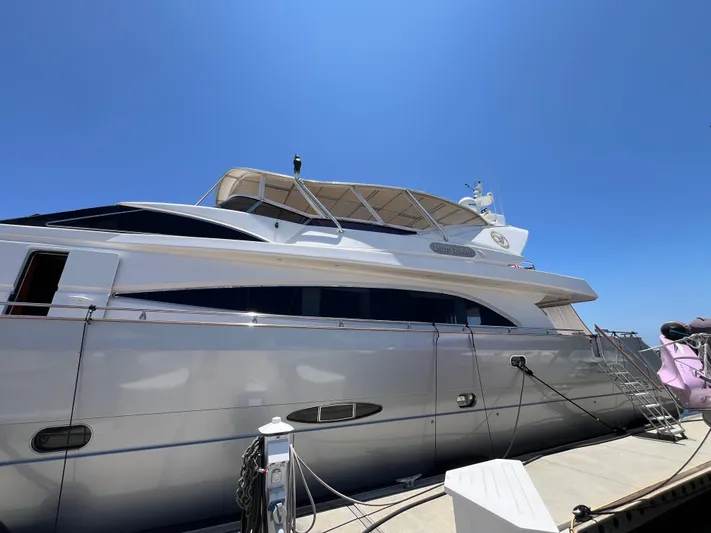 Endless Romance Yacht Photos Pics Luxury 2001 Astondoa 95GLX yacht docked under clear blue sky.