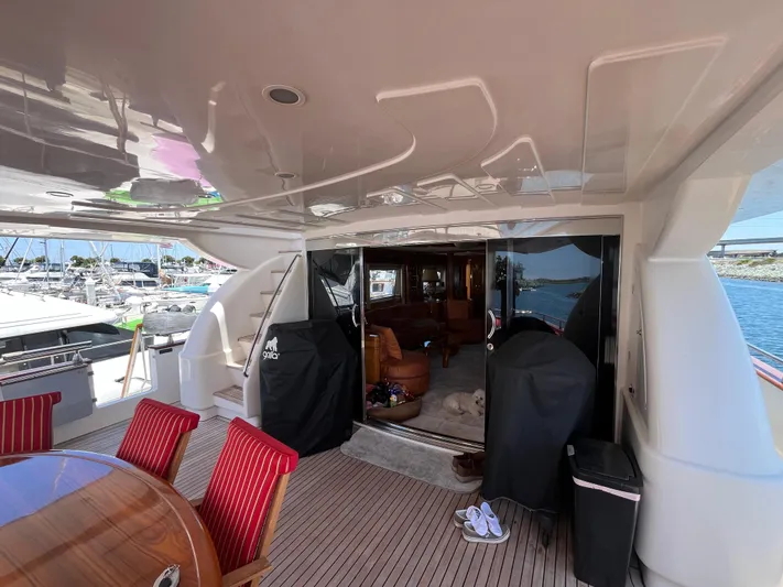 Endless Romance Yacht Photos Pics Luxurious 2001 Astondoa 95GLX yacht deck with elegant seating and marina view.