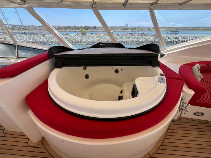 Endless Romance Yacht Photos Pics Luxurious jacuzzi on 2001 Astondoa 95GLX yacht with red seating and scenic water view.