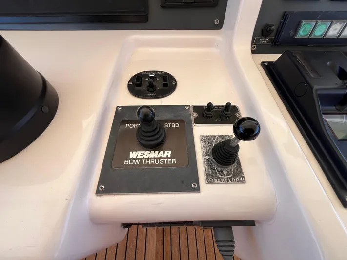 Endless Romance Yacht Photos Pics Control panel of a 2001 Astondoa 95GLX yacht featuring Wesmar bow thruster joystick.