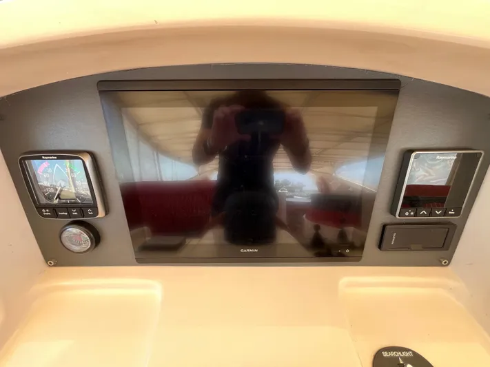 Endless Romance Yacht Photos Pics Control panel of a 2001 Astondoa 95GLX yacht with Garmin and Raymarine displays.