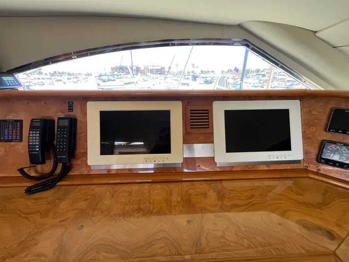 Endless Romance Yacht Photos Pics Control panel of 2001 Astondoa 95GLX yacht with screens and communication devices.