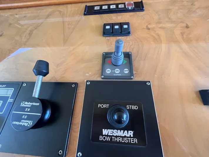 Endless Romance Yacht Photos Pics Control panel of a 2001 Astondoa 95GLX yacht featuring Wesmar bow thruster controls.