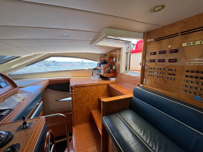 Endless Romance Yacht Photos Pics Luxurious interior of 2001 Astondoa 95GLX yacht with control panel and seating area.