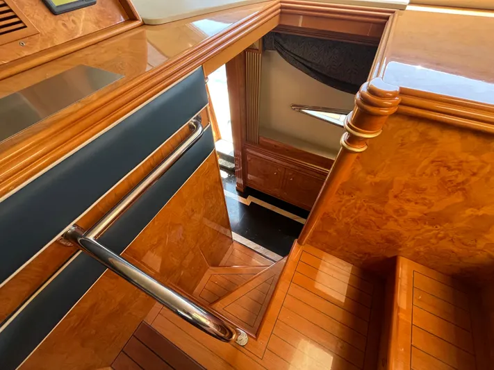 Endless Romance Yacht Photos Pics Wooden staircase inside 2001 Astondoa 95GLX yacht, featuring polished handrails and elegant design.