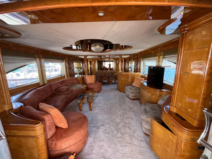 Endless Romance Yacht Photos Pics Luxurious interior of 2001 Astondoa 95GLX yacht with elegant wood finishes and plush seating.