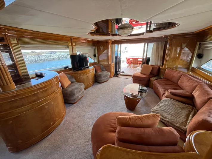 Endless Romance Yacht Photos Pics Luxurious interior of 2001 Astondoa 95GLX yacht with elegant wood finishes and plush seating.