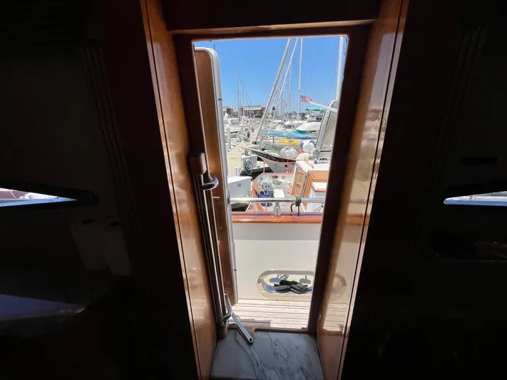 Endless Romance Yacht Photos Pics View from inside a 2001 Astondoa 95GLX yacht, looking out to a marina.