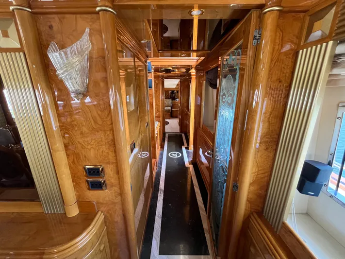 Endless Romance Yacht Photos Pics Luxurious interior of 2001 Astondoa 95GLX yacht with polished wood finishes.