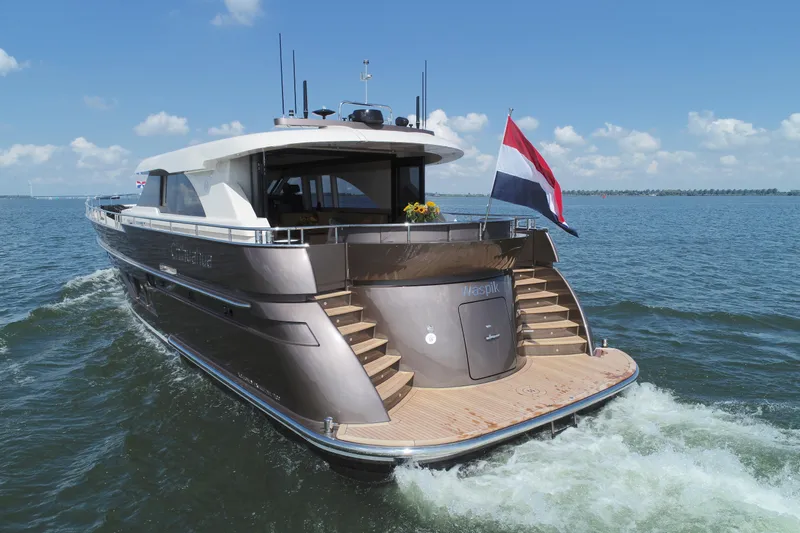  Yacht Photos Pics Luxurious 2019 Van den Hoven Executive 2100 yacht cruising on open water.